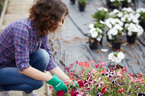 Team member wearing PPE while preparing garden tools